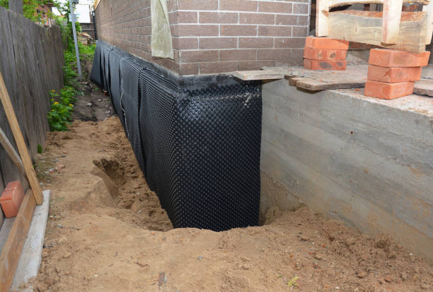 SJ Waterproofing Pros technician performing targeted Basement Waterproofing assessment in Hamden, OH